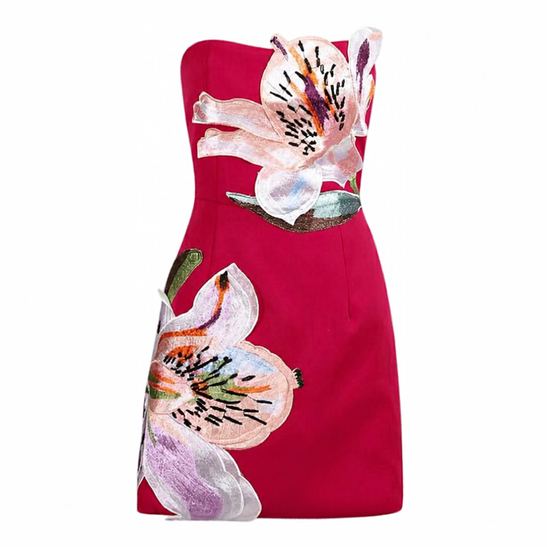 A strapless red mini dress with large 3D floral appliques of lilies in pink, white, purple, and green, shown against a plain white background.